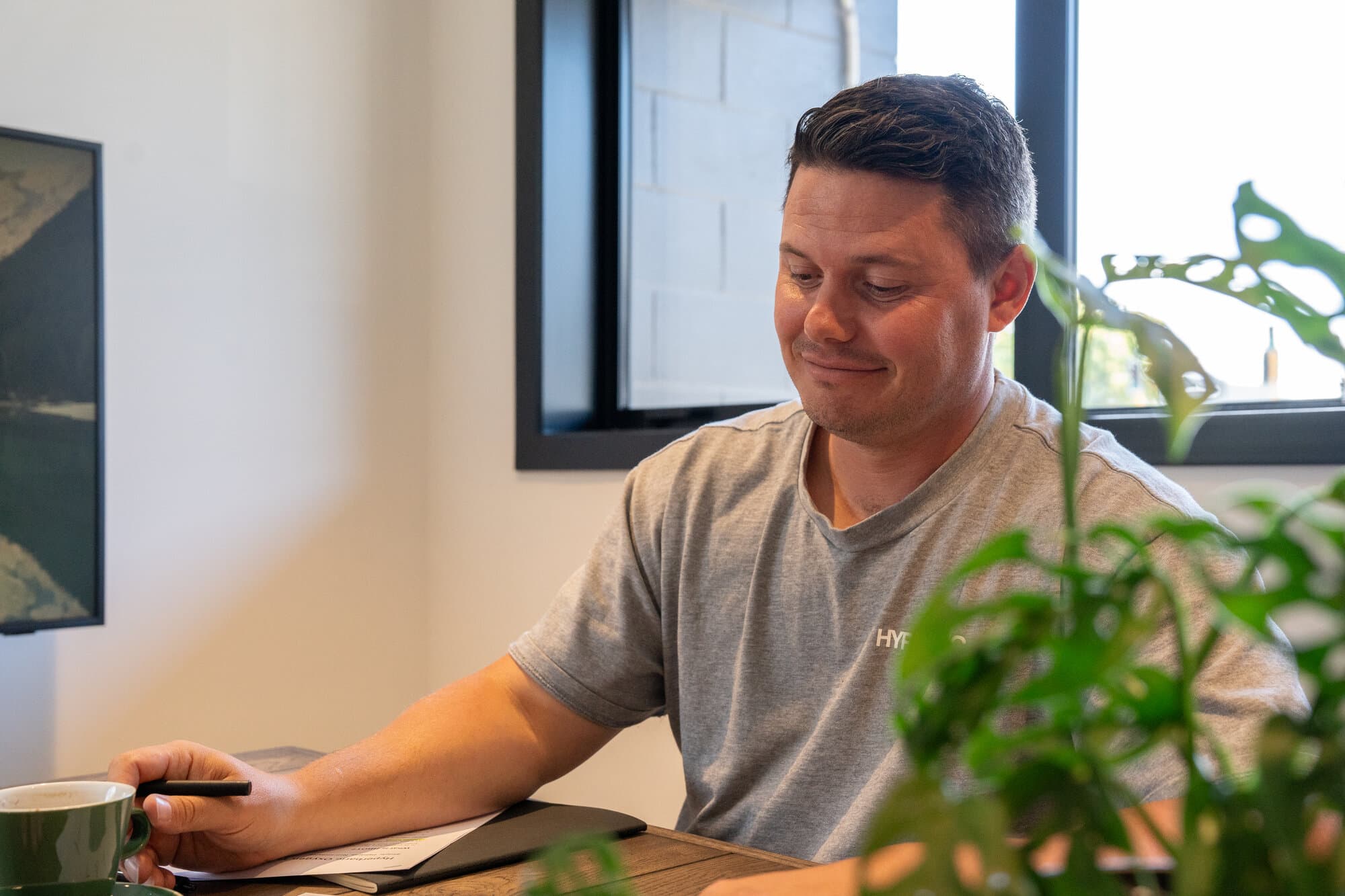 Callum reviewing documentation Callum reviewing documentation in a calm office setting
