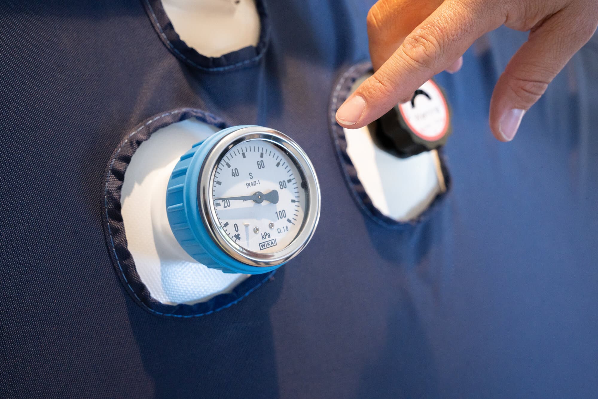 Close-up of the chamber pressure gauge and safety valve